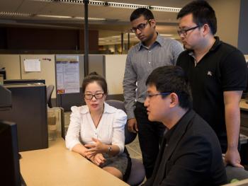 Jingrui He and her graduate students discuss their research on the interaction of varied data types