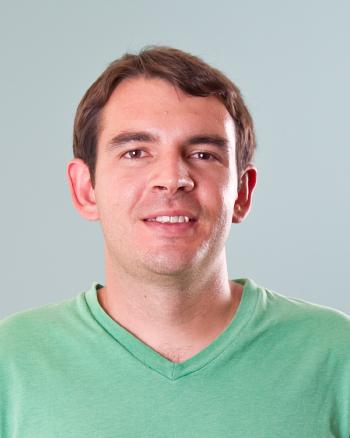 headshot of male Daniel Culotta wearing green t-shirt with brown hair and eyes