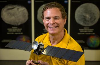 ASU associate research professor David Williams with model of Dawn spacecraft