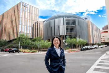 Master of Global Management student June Lau in front of Thunderbird's Global Headquarters.
