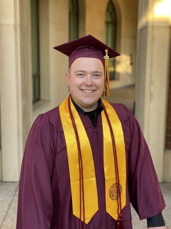 Dustin Vang stands with his ASU cap and gown on