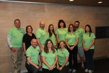 group of people in green polos