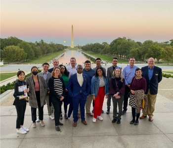 ASU Online Master of Arts International Affairs and Leadership students stand together with the Washington Monument in the background.