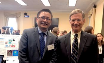 Yuji Zhao (left) poses with U.S. Representative Lamar Smith, chairman of the Committee on Science, Space, and Technology.