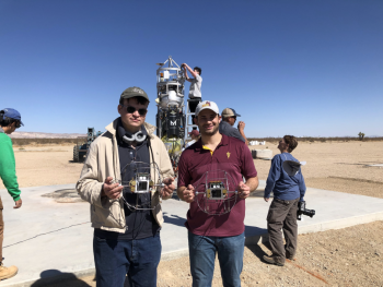 ASU students hold ExoCam prototypes for a NASA mission.