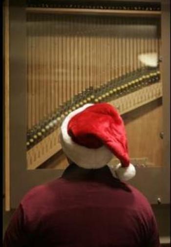 person wearing a Santa hat playing a carillon
