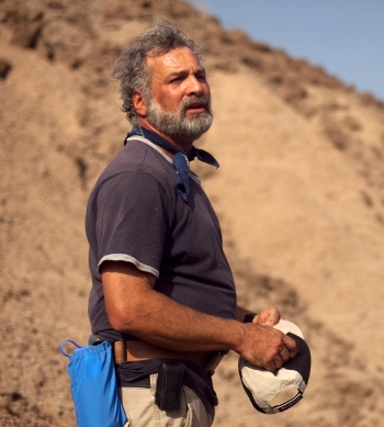 The late ASU Professor Bill Kimbel outdoors in a desert setting.