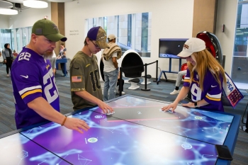 Super Bowl fans visiting the state-of-the-art Innovation Center at Thunderbird Global Headquarters.