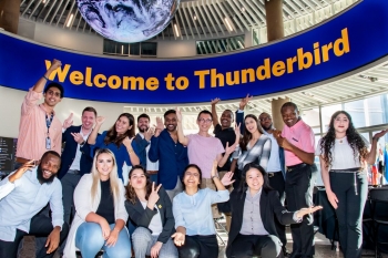 Group of students pose for a photo at Thunderbird School of Global Management during Foundations, Thunderbird's new student orientation.