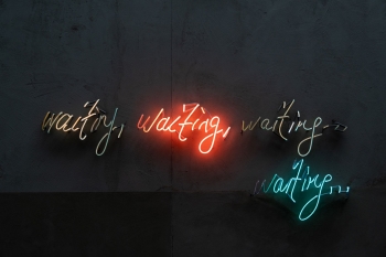 Abstract stock photo featuring the word "waiting" in various colors.