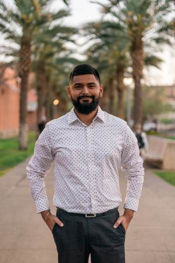 Incoming Teach For America corps member Nathan Martinez standing on Palm Walk at ASU's Tempe campus.