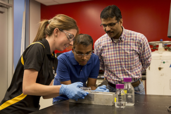 ASU engineering professor Narayanan Neithalath in lab with students