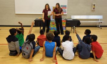 ASU nursing students answer questions at a health fair they organized