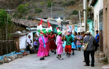 Nahua/Mexicano community dance in the streets during a celebration
