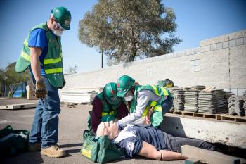 ROTC CERT trainees rescuing a dummy from underneath a block of cement