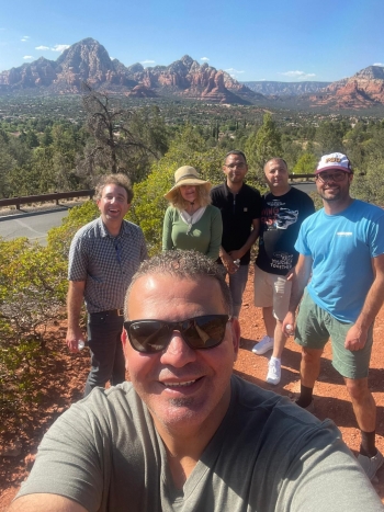 Group photo of faculty from ASU and An-Najah University in Sedona, Arizona, with mountain scenery in the background.