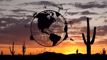 An illustrated globe with depictions of engineering disciplines superimposed on a desert sunset photo. 