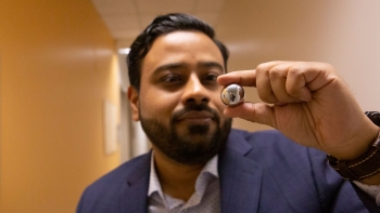 ASU Assistant Professor Kumar Ankit holds a steel ball bearing.