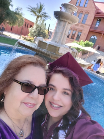 Graduating ASU student Shelly Smith-Phillips poses with her mother at the Kachina Fountain on ASU's Tempe campus. / Courtesy photo