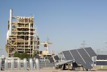 solar panels next to a fossil fuel plant in Arizona