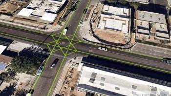 An arial image of an intersection with green gridlines overlaid on it