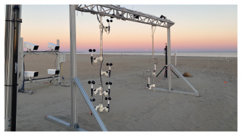 Scaffold-like structure used to captured the first high-resolution images of both sand and wind turbulence in natural terrain. The structure is on a beach at sunset. 