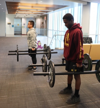 ASU ROTC students lifting weights.