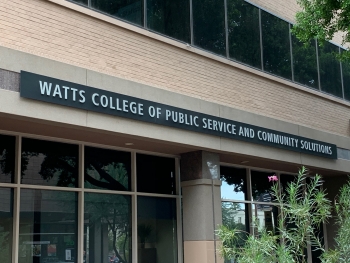 Exterior view of a building with a sign that reads: Watts College of Public Service and Community Solutions.