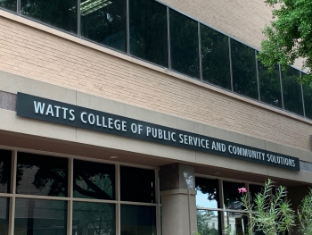 Exterior of building with sign that reads "Watts College of Public Service and Community Solutions."