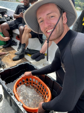 ASU SOLS student Zac Whaley working on coral restoration