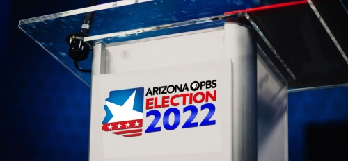Debate podium decorated with a logo that reads "Arizona PBS Election 2022"