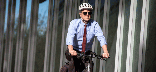 ASU nutrition Professor Chris Wharton rides a bike