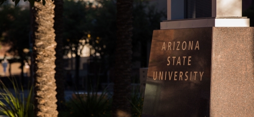 The base of a campus sign that reads Arizona State University.