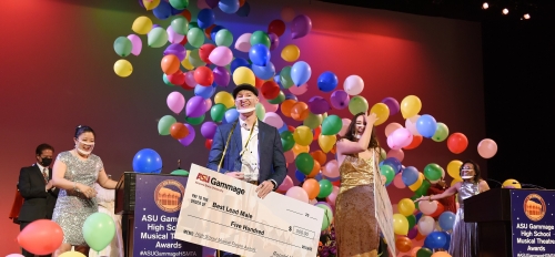 The Best Lead Male and Female winners of the 2021 ASU Gammage High School Musical Theatre Awards stand onstage surrounded by balloons.