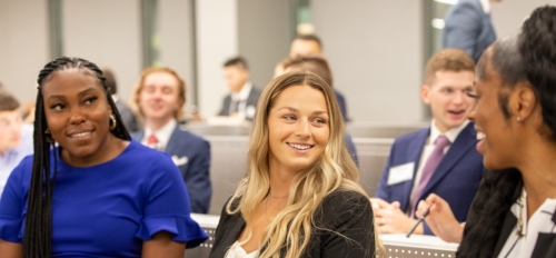 New Master of Sports Law and Business students socialize during an orientation session before the start of their first class.