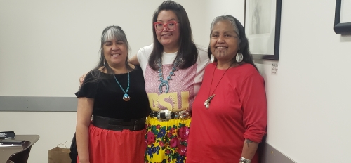 ASU alum Kelly Vallo wears a red ribbon skirt signifying her membership in the HONOR Collective, along with fellow matriarchs Melodie Lopez and Thomasa Riva.