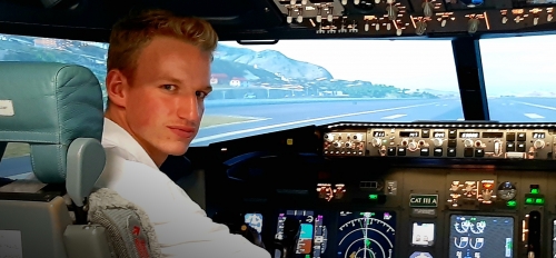 man sitting in cockpit of plane