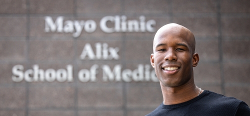 Portrait of student in front of Mayo Clinic Alix School of Medicine