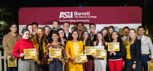 Photo of 2023 Barrett Honors College Gold Standard Award winners standing together and holding up award certificates.