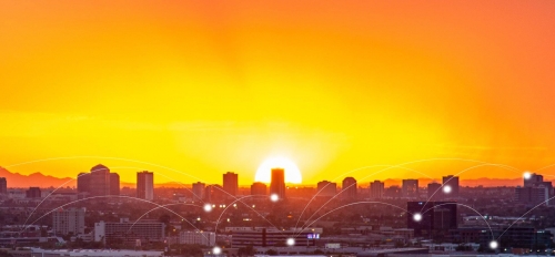 A city skyline against a sunset.