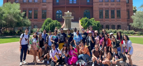 A group of International Students from the ASU-Cintana Sustainability and Innovation Summer Immersion Program pose in front of Old Main.