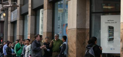 people standing in line in front of AT&T building