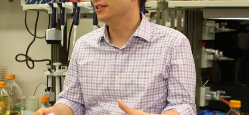 ASU professor Alexander Green talks in a Biodesign lab.