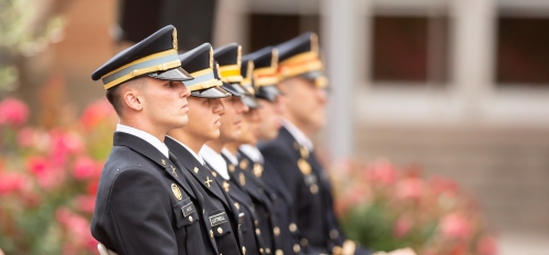 ASU Army ROTC graduating cadets seated in a row, wearing ceremonial regalia at the 2019 Spring Commissioning Ceremony.