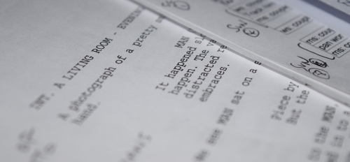 close-up photo of a screenplay typed on paper