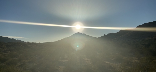 The sun rises over a mountain in a border landscape / Photo courtesy Martiza Estrada