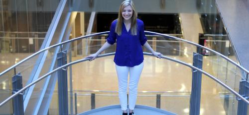 Student Breanne McCarthy portrait on a stairwell Biodesign