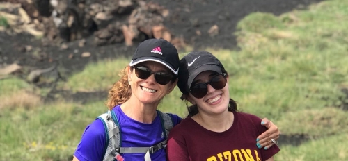 Principal Lecturer Chiara Dal Martello, left, stands with undergraduate student Bianca Navia at the top of Mt. Etna in Sicily, Italy, in June 2018.