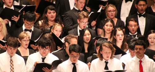 Students singing in a choir.
