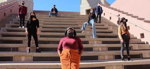 The student cast of the ASU School of Music, Dance and Theatre's Color Cabaret stand at varying points on a staircase